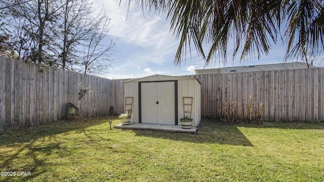 view of shed with a fenced backyard