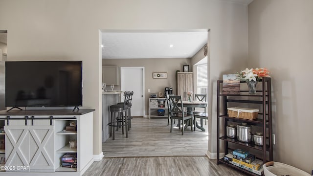 living room with wood finished floors and baseboards