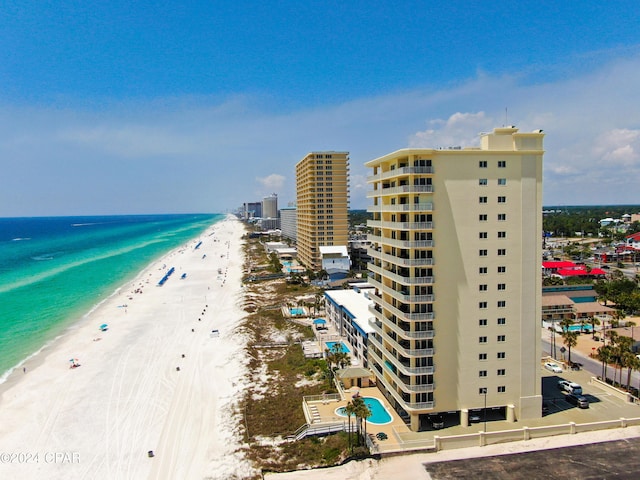 exterior space featuring a city view, a beach view, and a water view