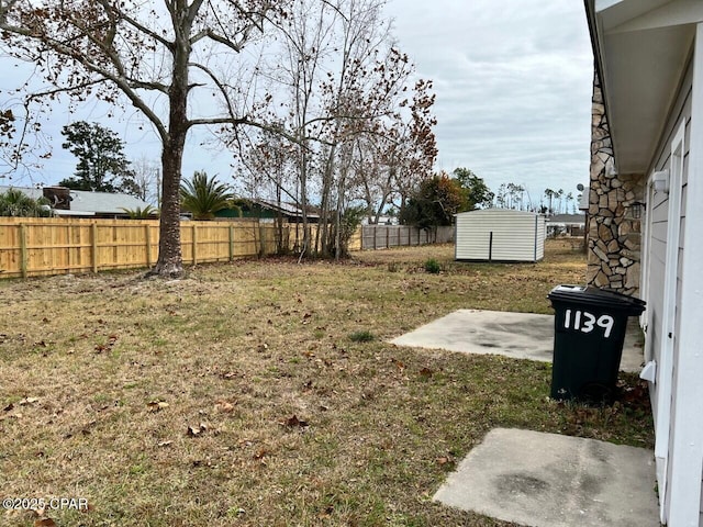 view of yard with a patio area and a fenced backyard