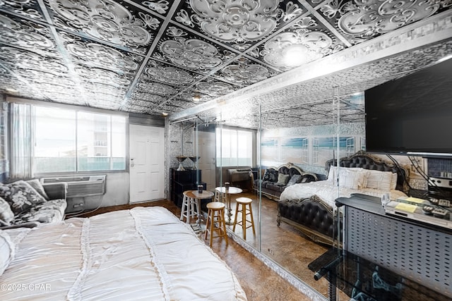 bedroom featuring a wall mounted air conditioner and an ornate ceiling