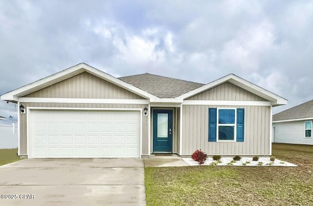 single story home with an attached garage, concrete driveway, a front yard, and a shingled roof