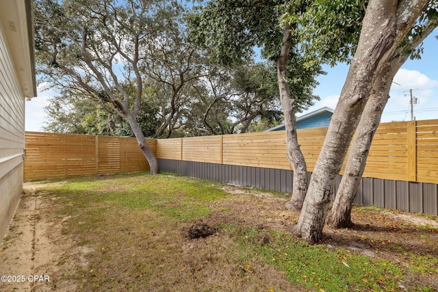 view of yard with a fenced backyard