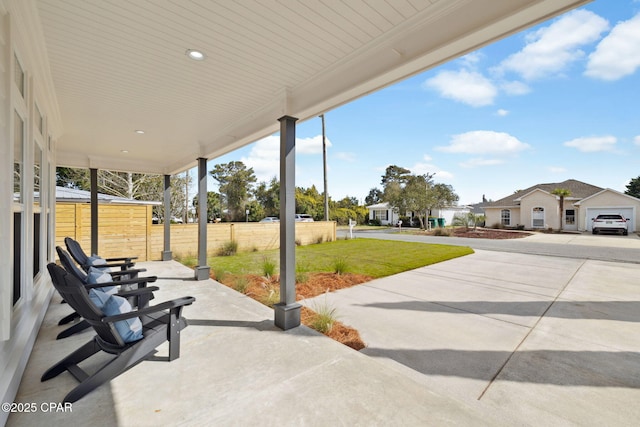 view of patio featuring fence