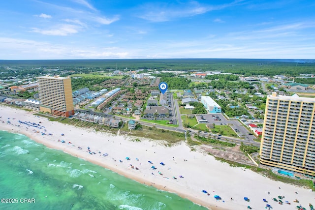 drone / aerial view with a water view and a beach view