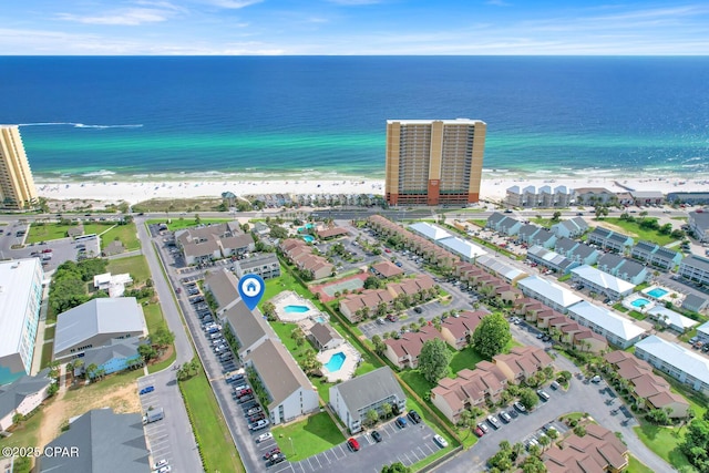 drone / aerial view featuring a view of the beach and a water view