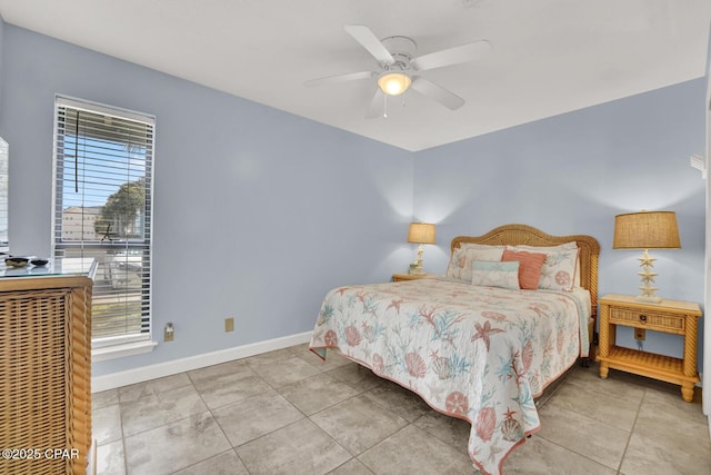 bedroom with tile patterned flooring, a ceiling fan, and baseboards