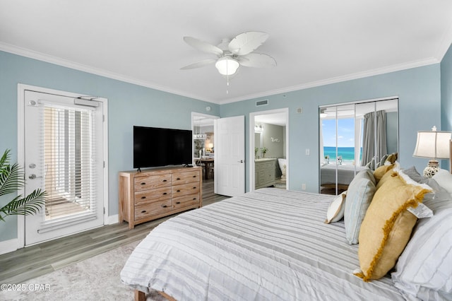 bedroom with access to exterior, ornamental molding, and wood finished floors