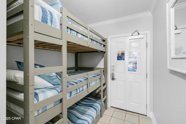 tiled bedroom featuring crown molding