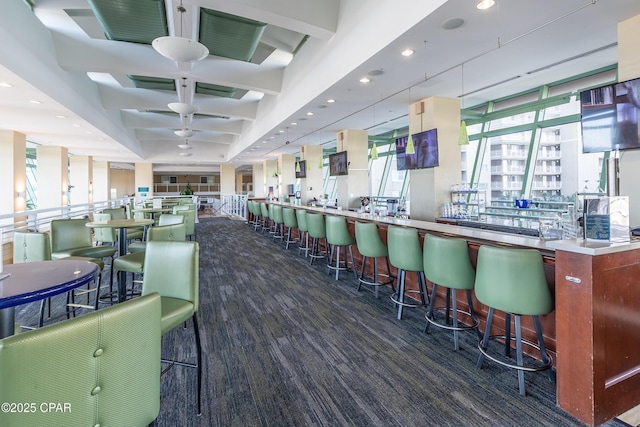 carpeted dining area with recessed lighting