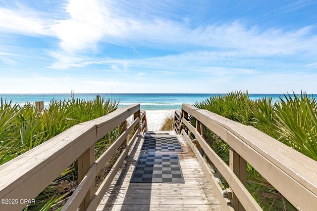 view of property's community featuring a view of the beach and a water view