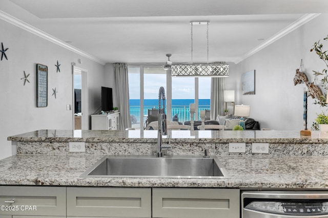 kitchen with ornamental molding, a sink, dishwashing machine, and light stone countertops