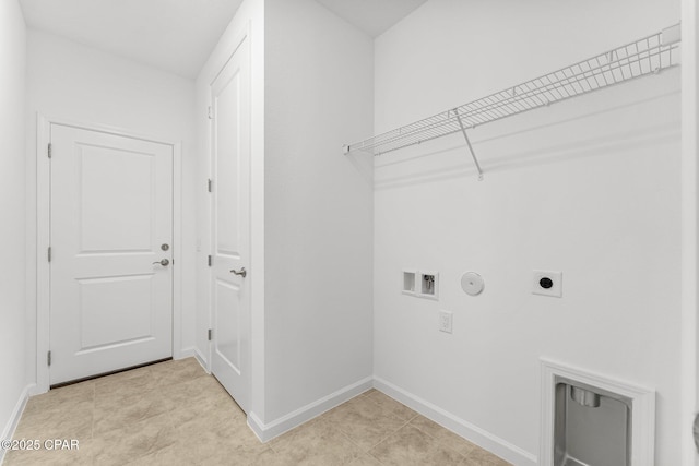 washroom with laundry area, hookup for a washing machine, hookup for an electric dryer, gas dryer hookup, and baseboards