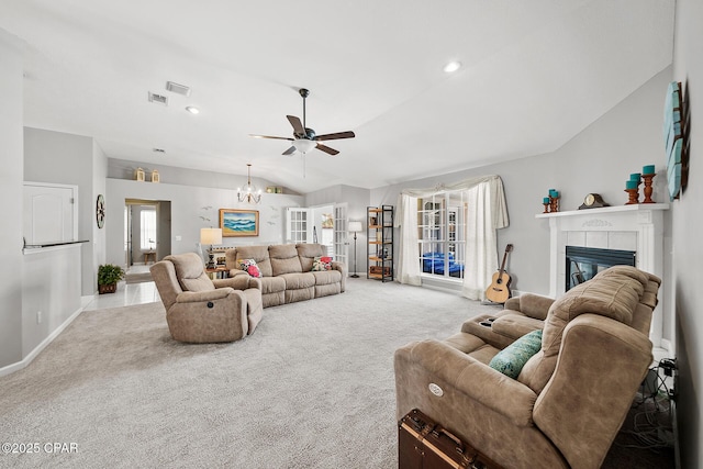 carpeted living room with a fireplace, recessed lighting, vaulted ceiling, baseboards, and ceiling fan with notable chandelier