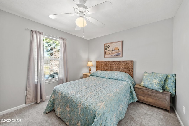 bedroom with carpet floors, a ceiling fan, and baseboards