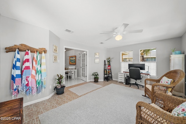 office with ceiling fan, visible vents, and baseboards