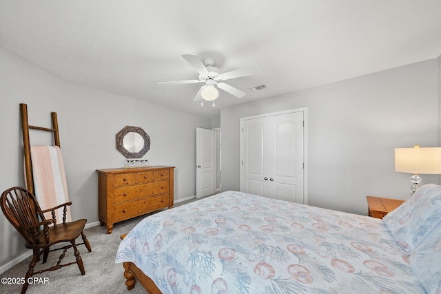 carpeted bedroom with baseboards, visible vents, and ceiling fan