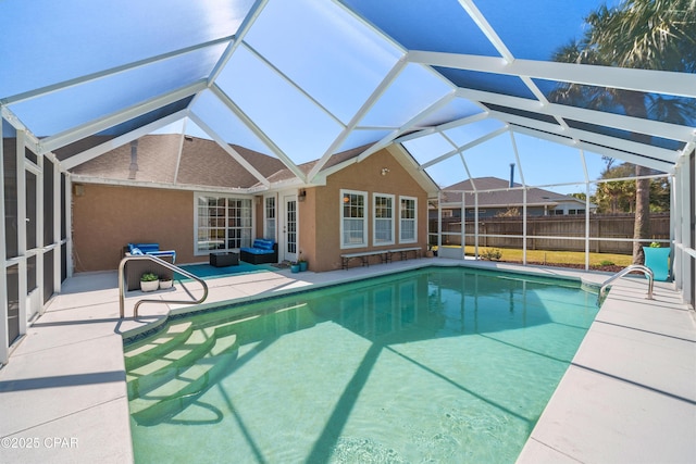 view of pool with a fenced in pool, glass enclosure, a patio, and fence