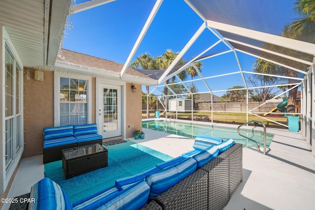 view of patio / terrace featuring a playground, a fenced backyard, a lanai, outdoor lounge area, and a fenced in pool