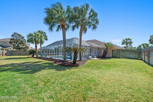 view of yard featuring a fenced in pool, a lanai, and a fenced backyard