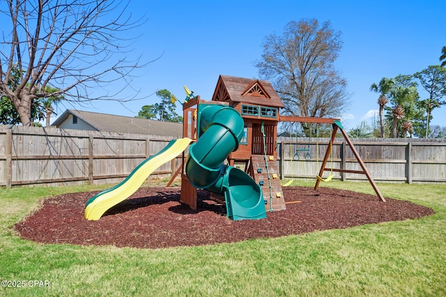 view of jungle gym featuring a fenced backyard and a lawn