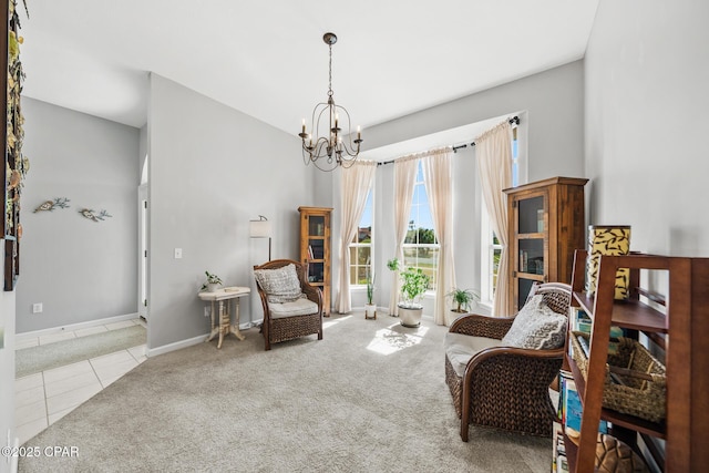 sitting room featuring a chandelier, carpet, baseboards, and tile patterned floors