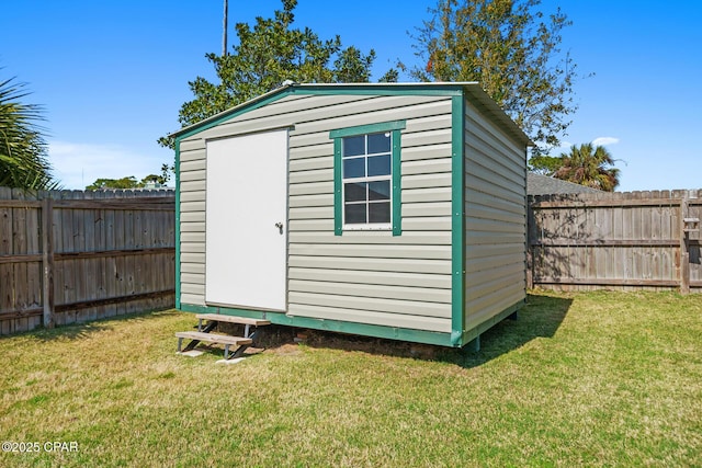 view of shed featuring a fenced backyard