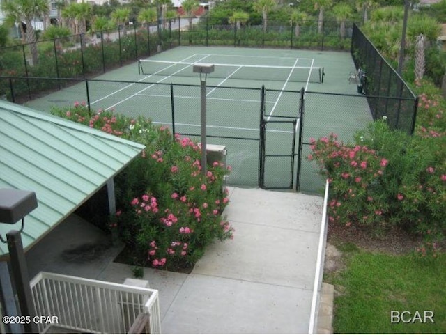 view of sport court with fence and a gate