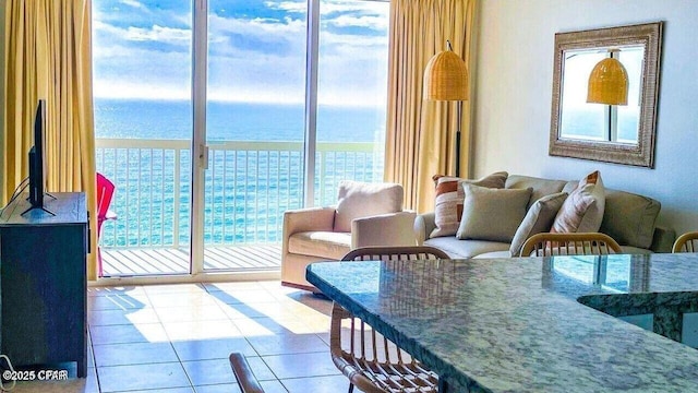tiled living room with a water view