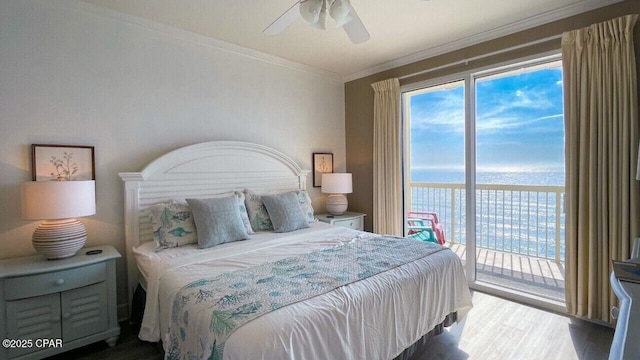bedroom with wood finished floors, access to outside, a water view, a ceiling fan, and crown molding