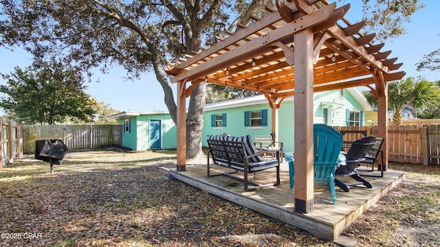 view of yard with a fenced backyard, a storage unit, a pergola, and an outdoor structure