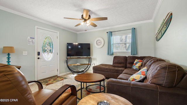 living area featuring a textured ceiling, ornamental molding, light tile patterned floors, and a ceiling fan