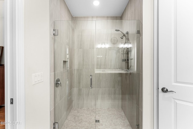 full bath with a shower stall