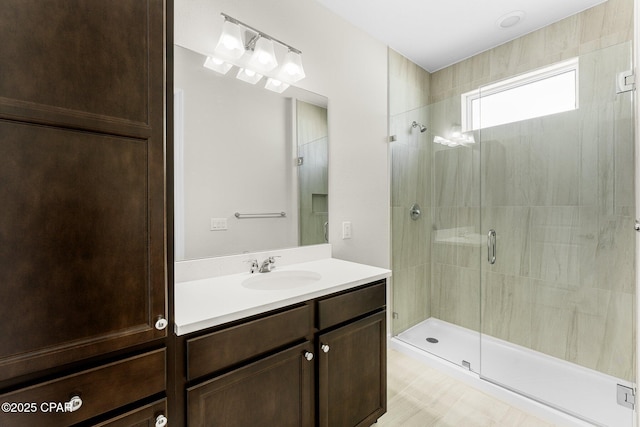 full bath featuring a stall shower and vanity