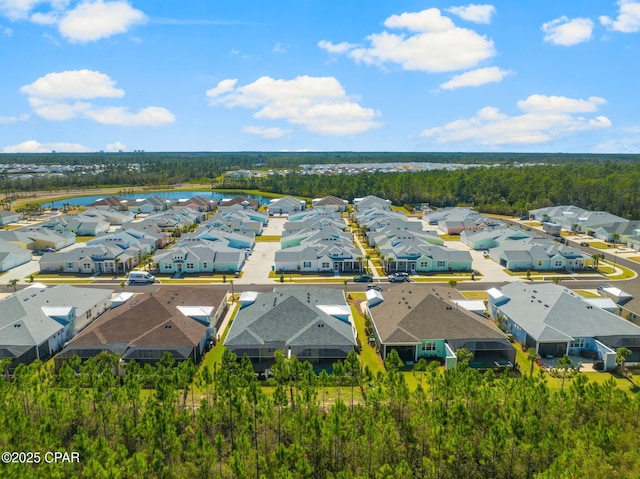 birds eye view of property with a residential view