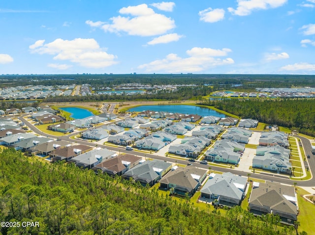 birds eye view of property featuring a water view and a residential view