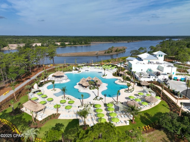 birds eye view of property with a water view