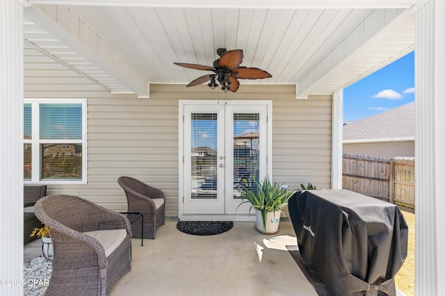 view of patio featuring a ceiling fan, fence, french doors, and a grill