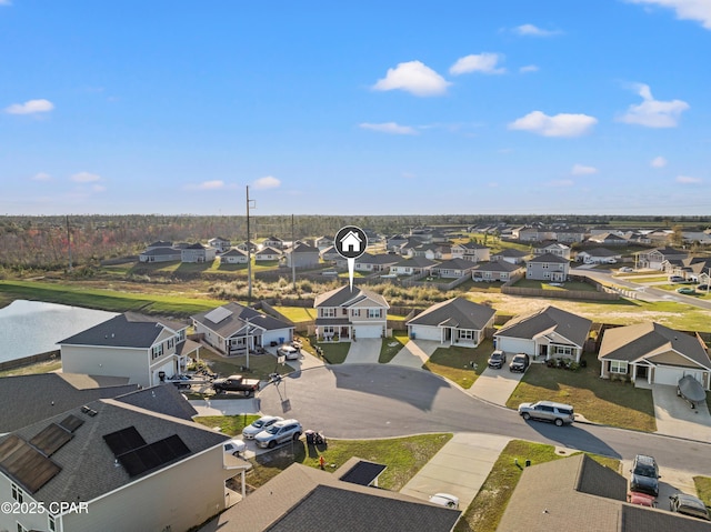 drone / aerial view with a residential view and a water view