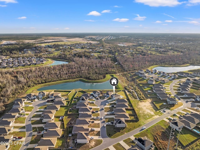 birds eye view of property featuring a residential view and a water view