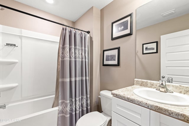 bathroom featuring visible vents, shower / tub combo, toilet, and vanity