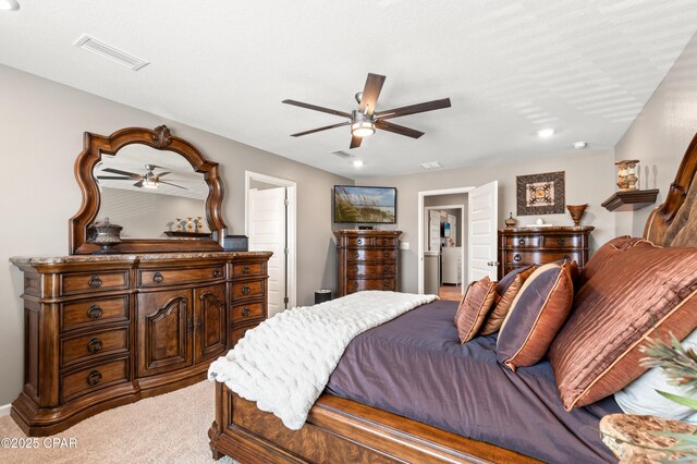 carpeted bedroom featuring visible vents and ceiling fan