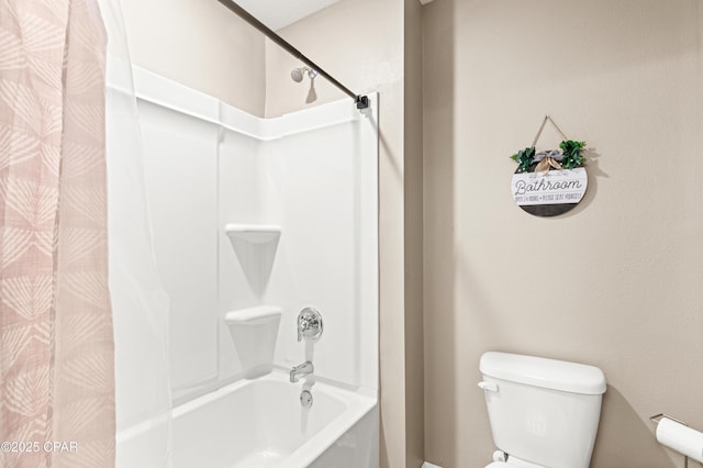 bathroom featuring toilet and shower / bath combo