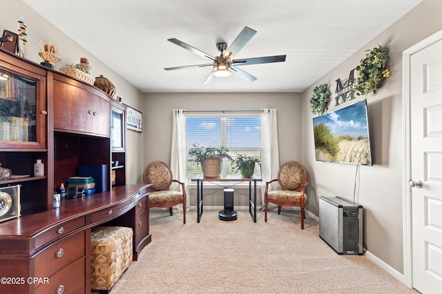 sitting room with light colored carpet, baseboards, a wealth of natural light, and ceiling fan