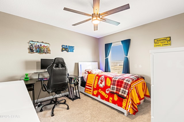 carpeted bedroom featuring baseboards and ceiling fan