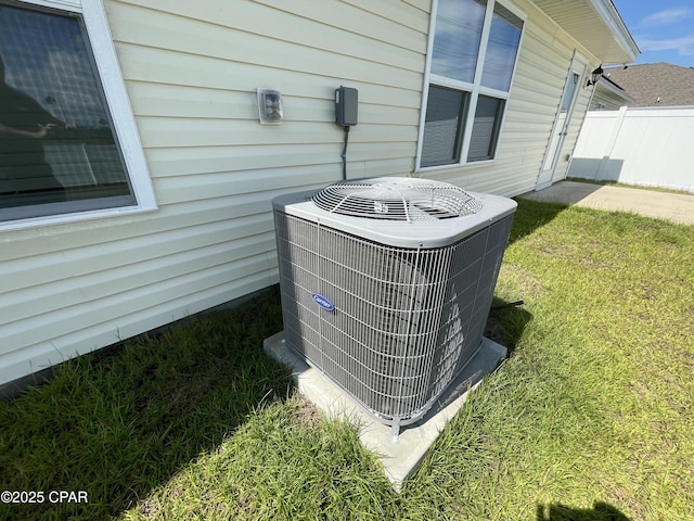 exterior details with cooling unit and fence