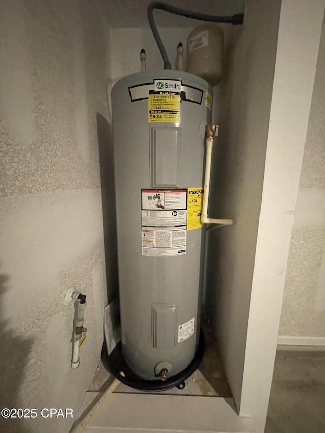 utility room with electric water heater