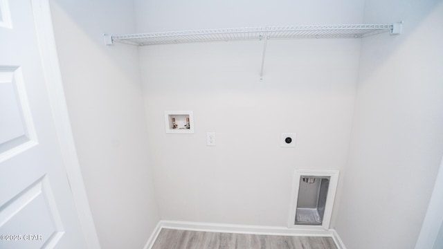 laundry room featuring laundry area, baseboards, wood finished floors, hookup for an electric dryer, and washer hookup