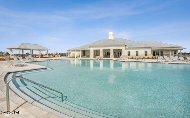 pool featuring a patio and a gazebo