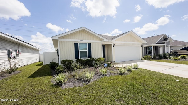 ranch-style home featuring driveway, an attached garage, fence, and a front lawn